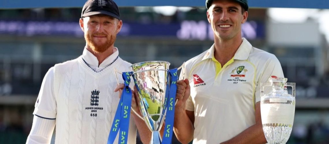 England cricket captain Ben Stokes and Pat Cummins, skipper of Australia, post with the Ashes trophy.