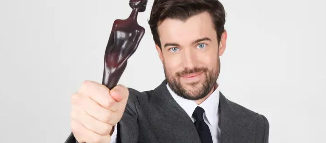 Host Jack Whitehall clutches an award in a promotional image for the BRITs 2025