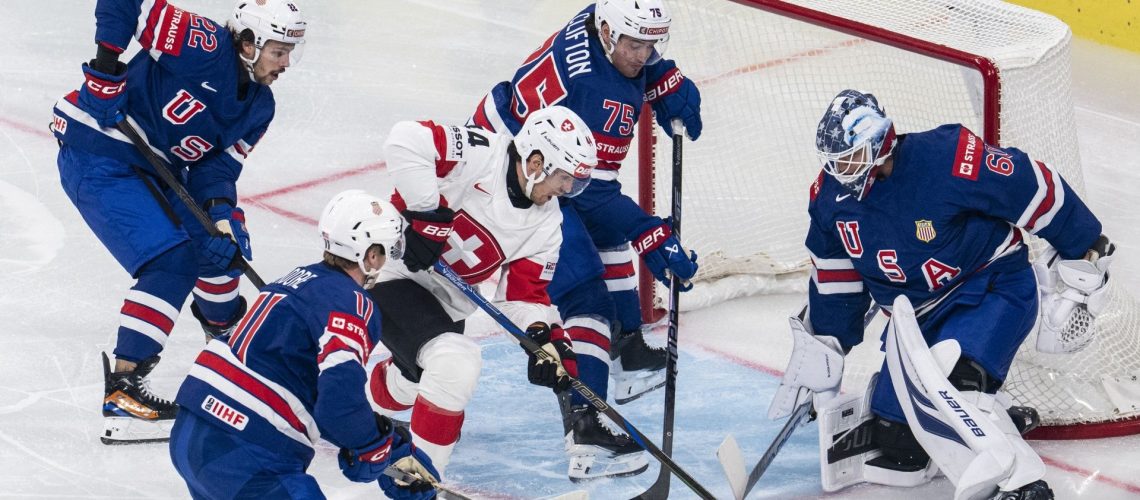 Switzerland's Pius Suter scores against USA's Joseph Woll at the 2026 IIHF World Championship