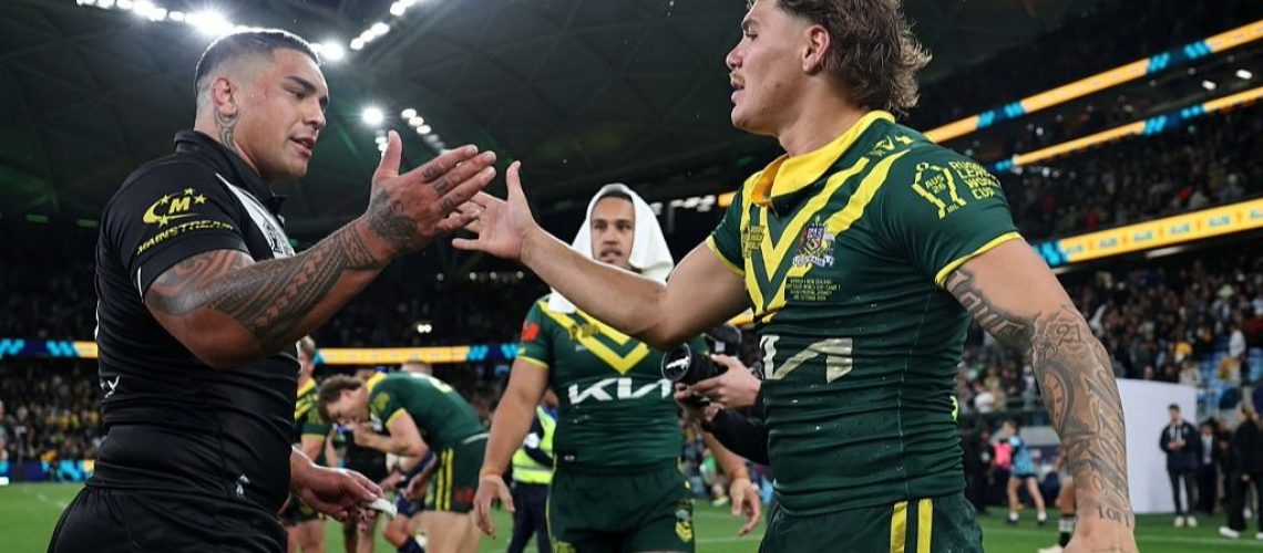 Erin Clark of New Zealand and Reece Walsh of Australia embrace after the opening game of the Rugby League World Cup 2026