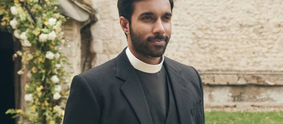 Reverend Alphy Kottaram (played by Rishi Nair). DI Geordie Keating (Robson Green), the other half of the vicar-detective team, not pictured.
