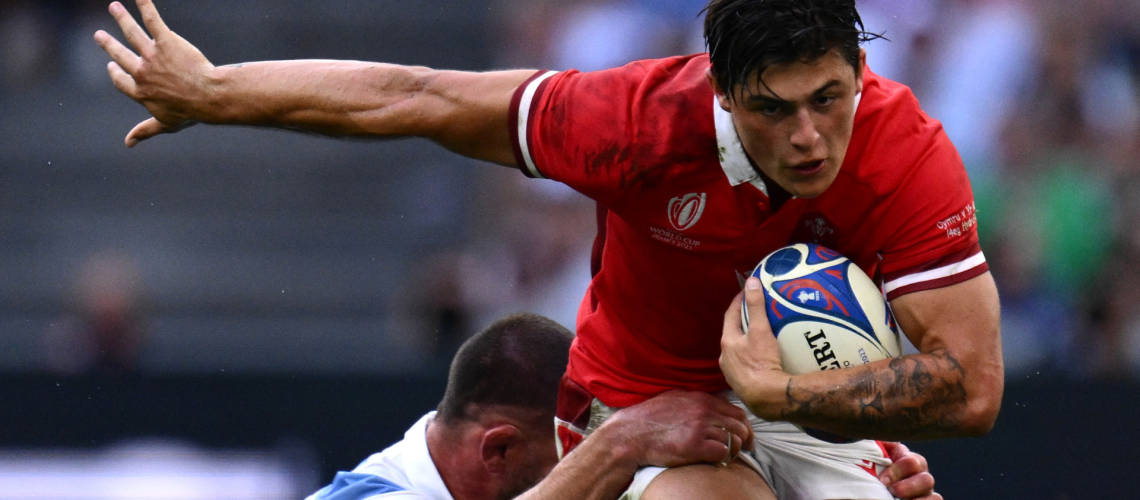 Wales' wing Louis Rees-Zammit (R) is tackled by Argentina's flanker Marcos Kremer during the France 2023 Rugby World Cup quarter-final match between Wales and Argentina at the Stade Velodrome in Marseille, south-eastern France, on October 14, 2023.