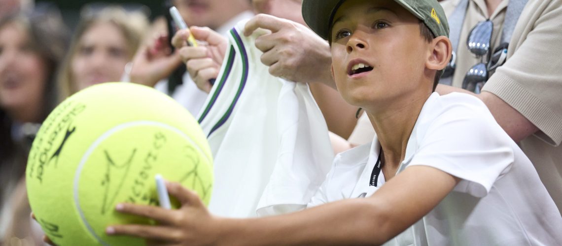 Wimbledon fan asking for a signature.