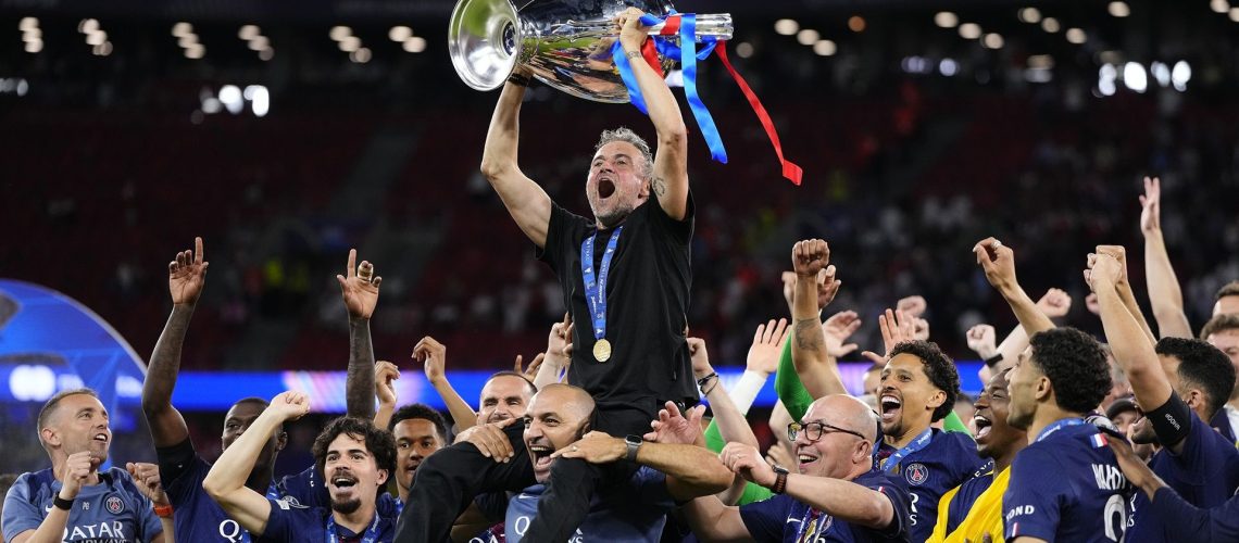 Luis Enrique head coach of PSG lifts the Champions League trophy following the UEFA Champions League Final 2026 match between Paris Saint-Germain and Arsenal FC at Puskas Arena.