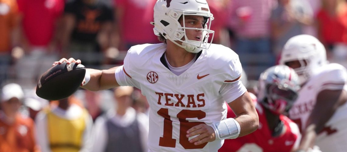 Quarterback Arch Manning #16 of the Texas Longhorns passes the ball during a college football game against the Ohio State Buckeyes.