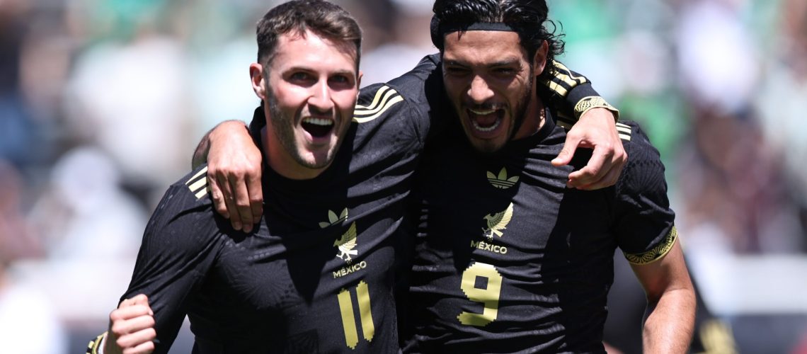 Santiago Gimenez #11 of Mexico celebrates after scoring his teammates first goal with his teammate Raul Jimenez #9