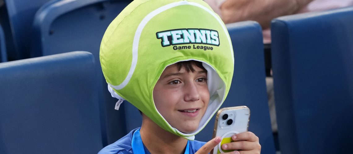 A fan takes pictures during the match between Ben Shelton of the United States and Camilo Ugo Carabelli of Argentina during Day 4 of the Cincinnati Open at the Lindner Family Tennis Center on August 10, 2025 in Mason, Ohio.