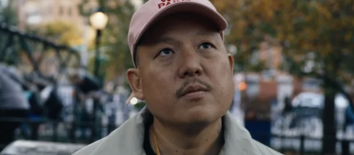 Eddie Huang director of Vice documentary 2025 wearing a pink 'Wet Paint' baseball cap