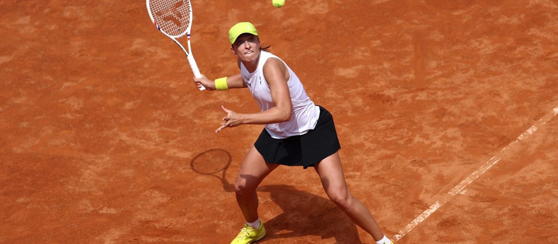 Iga Swiatek plays a shot in the French Open 2025