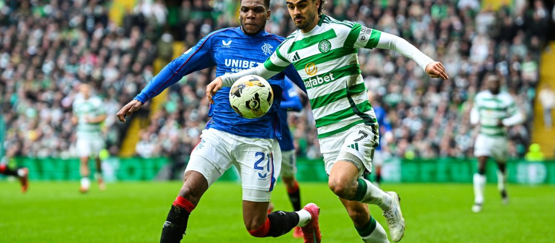 Dujon Sterling (left) and Jota (right) fight for the ball in the Celtic vs Rangers, Old Firm derby.