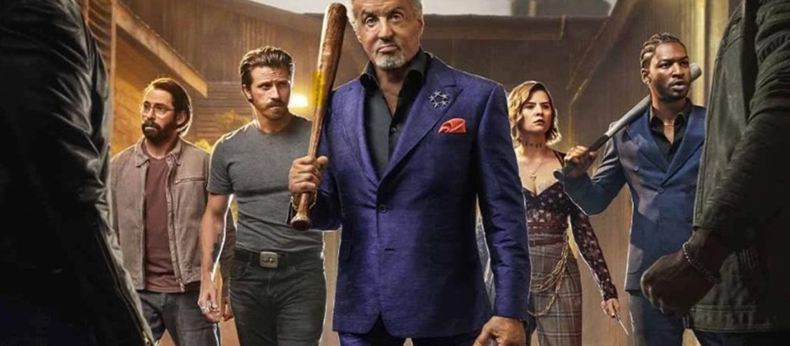 Flanked by his criminal associates, sharply dressed gangster Dwight Manfredi (Sylvester Stallone) wields a baseball ball as he faces off against two shadowy assailants in key art for "Tulsa King" season 3.