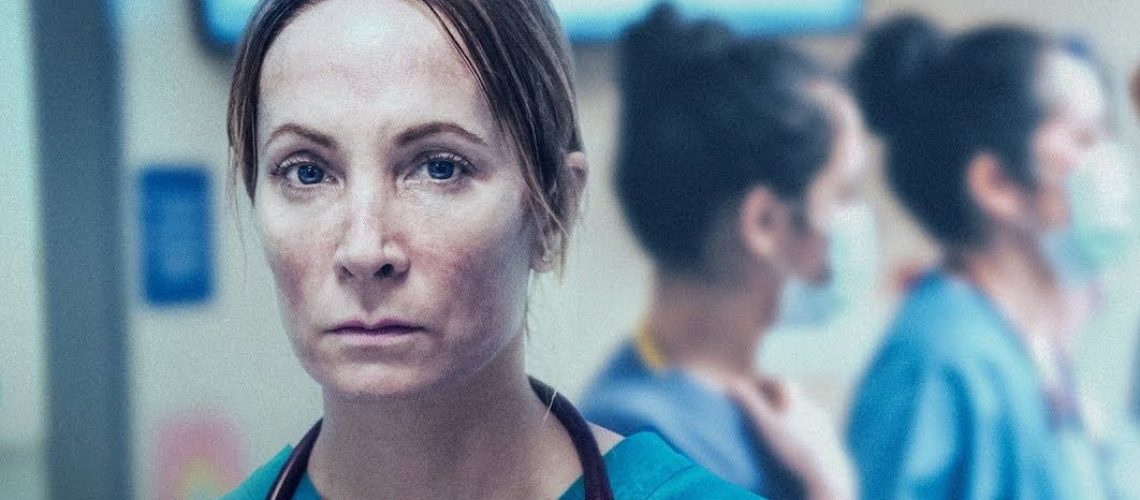 Golden Globe winning actress Joanna Froggatt, dressed in blue medical scrubs, stars in harrowing new pandemic drama Breathtaking