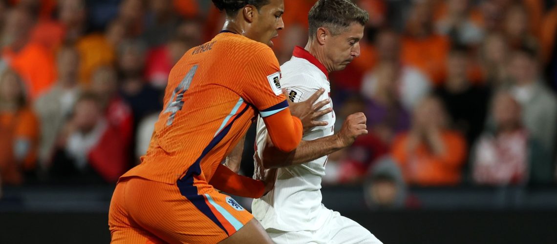 Virgil van Dijk and Robert Lewandowski tussling for the ball in a recent Poland vs Netherlands game