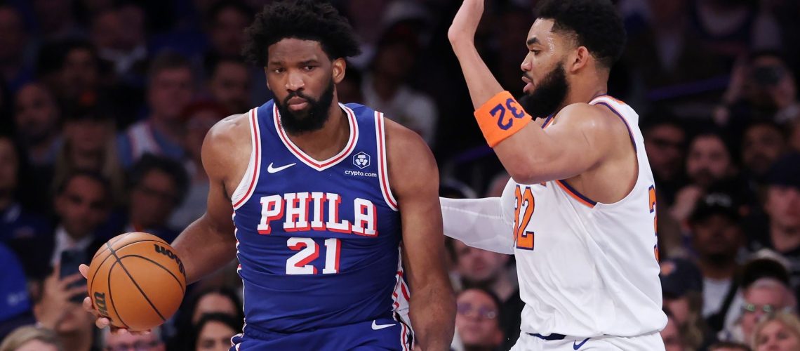Joel Embiid of the Philadelphia 76ers works against Karl-Anthony Towns of the New York Knicks during the 2026 NBA Playoffs