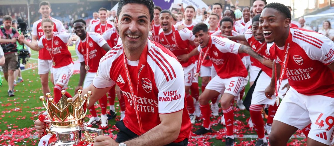Mikel Arteta and the Arsenal team celebrate winning the Premier League