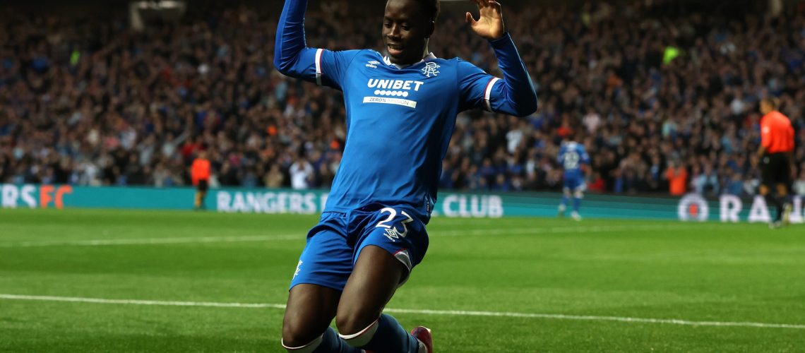 Djeidi Gassama of Rangers celebrates scoring his team's third goal during the UEFA Champions League Third Qualifying Round First Leg match between Rangers and Viktoria Plzen at Ibrox Stadium on August 05, 2025 in Glasgow, Scotland.