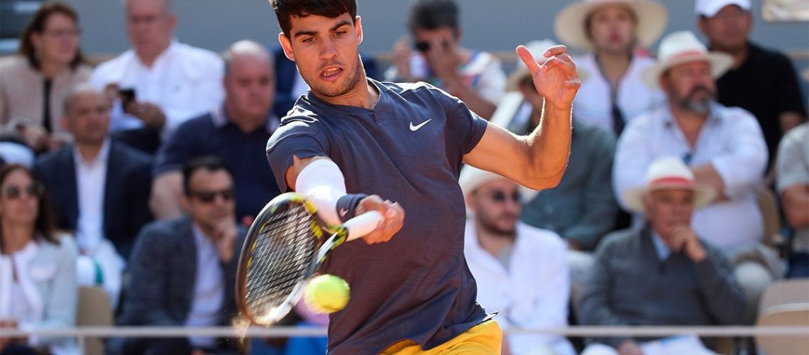 Carlos Alcaraz hits a forehand on his way to winning the French Open final in June 2024