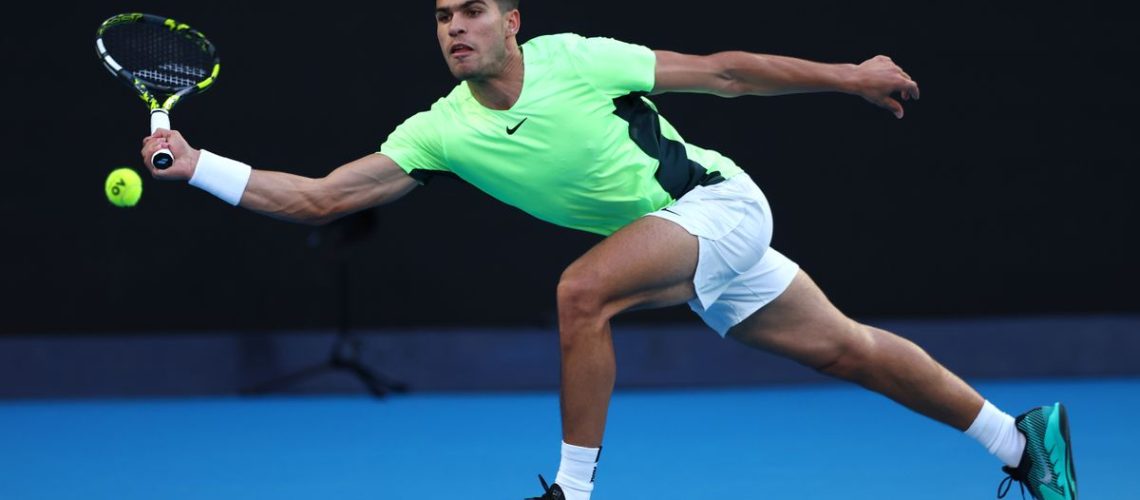 Carlos Alcaraz of Spain at full stretch on court at the Australian Open 2024, ahead of the Alcaraz vs Sonego live stream