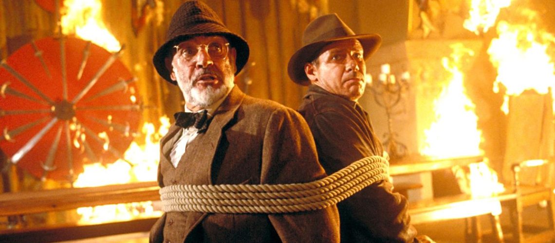 Sean Connery and Harrison Ford are tied up in a fiery room in Indiana Jones and the Last Crusade