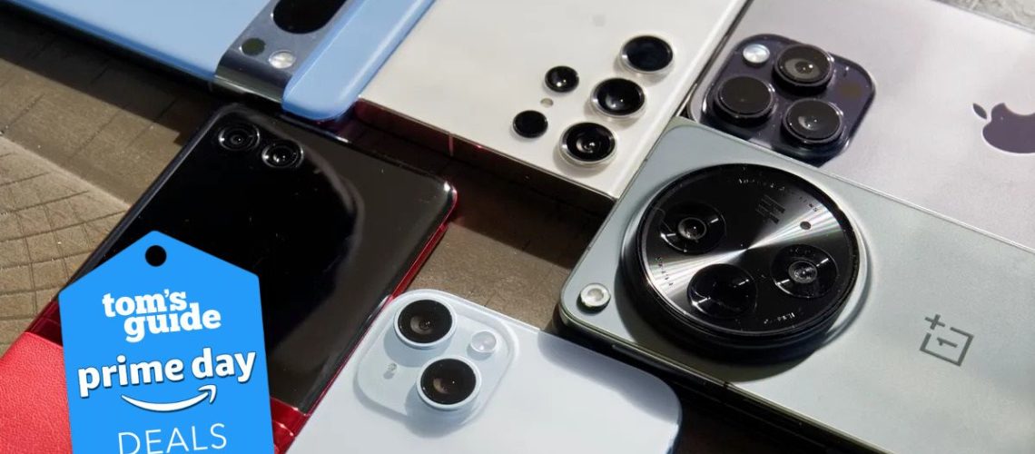 A bunch of phones on table with prime day badge nearby,