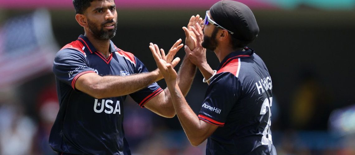 Saurabh Netravalkar of USA celebrates taking a wicket with his teammate at the T20 World Cup 2024