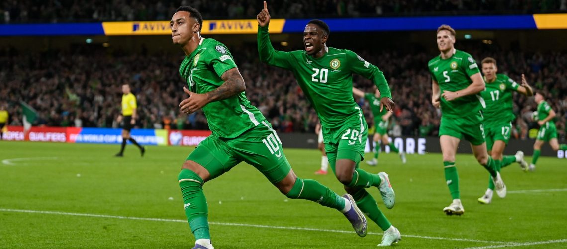 Adam Idah of Republic of Ireland, 10, celebrates with teammate Chiedozie Ogbene, 20, after scoring their side's second goal during the FIFA World Cup 2026 Group F qualifying match between Republic of Ireland and Hungary at the Aviva Stadium in Dublin.