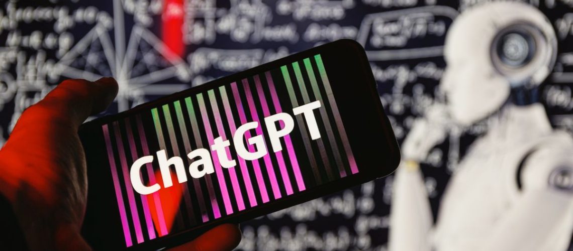 ChatGPT logo on phone in front of robot thinking