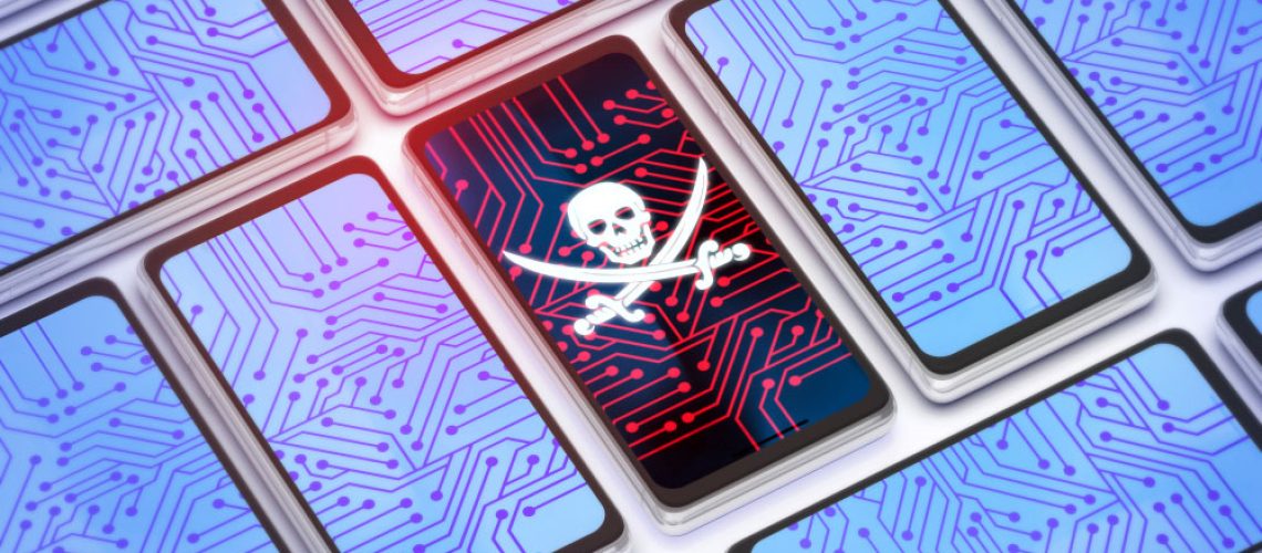 One phone with skull and crossbones on screen among several other clean-looking phones.