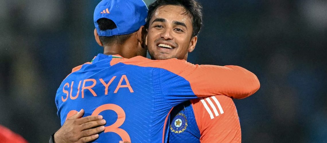 India's Abhishek Sharma celebrates with his captain Suryakumar Yadav (L) after taking a wicket in the build up to the South Africa vs India 1st T20 2024 live stream from Kingsmead
