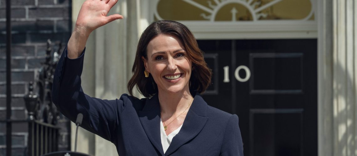 Abigail Dalton (Suranne Jones) waves behind a podium in a scene from Netflix's "Hostage"