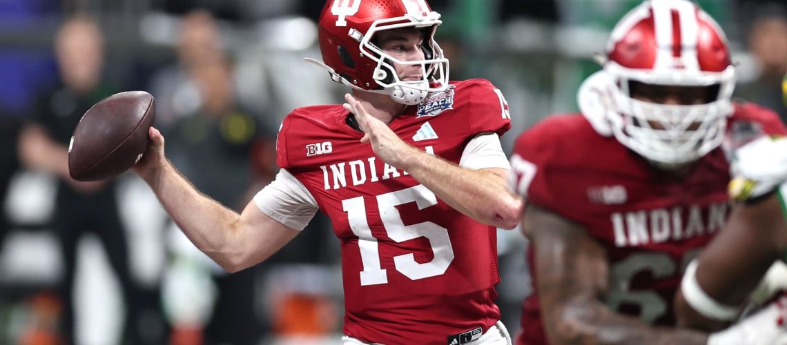 Fernando Mendoza of the Indiana Hoosiers attempts a pass during a College Football Playoff game.