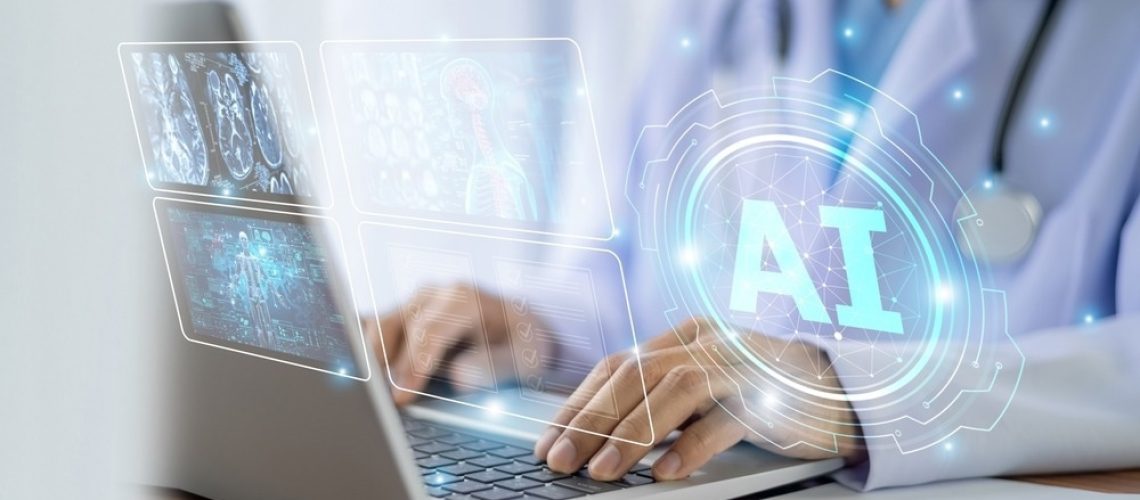 A healthcare professional using a laptop with holographic AI technology visuals, including medical imaging and data analysis displays.