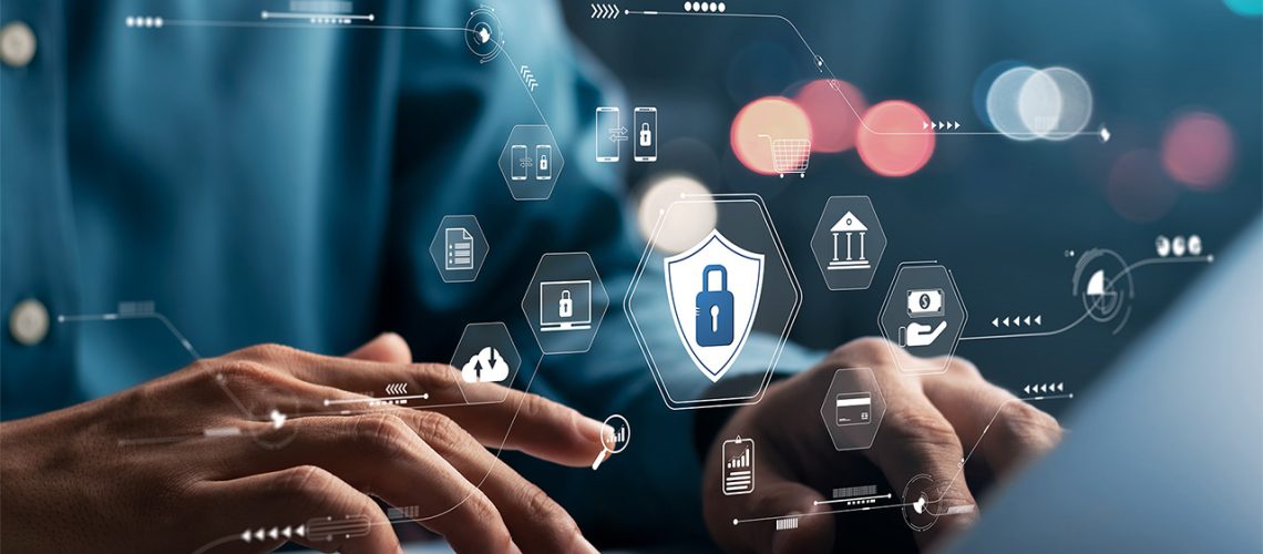 Image of man on computer with data security ecosystem