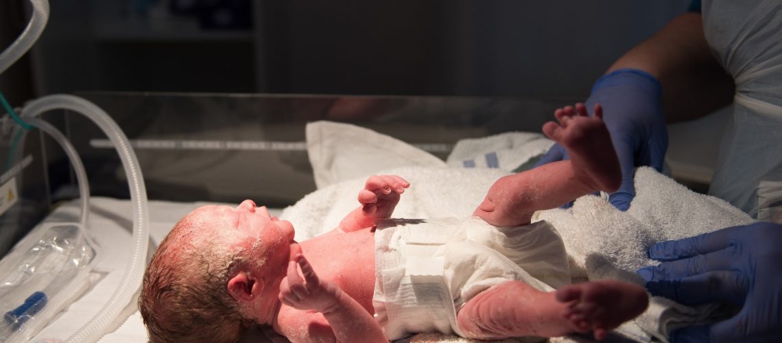 A young baby girl is born premature weighing just 4lbs, pictured here less than 5 minutes old