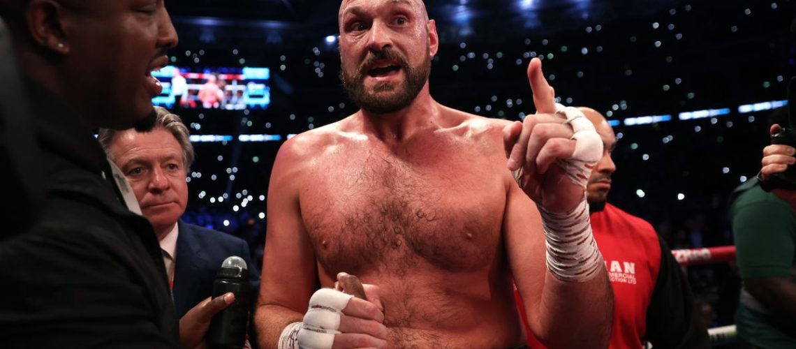 Tyson Fury, wearing red shorts emblazoned with