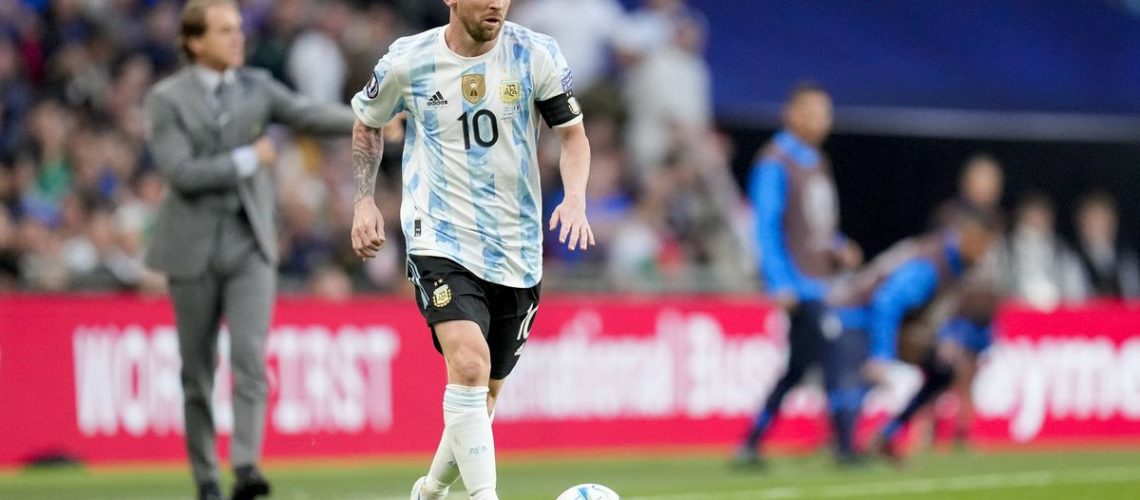 Lionel Messi on the ball for Argentina at the Copa America in the blue and white striped home kit