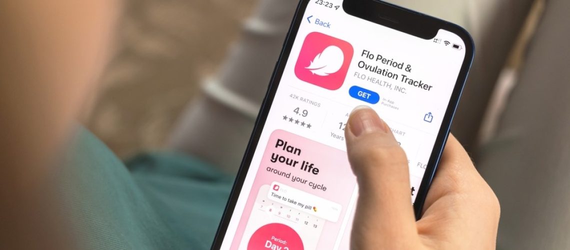 a photo of a woman using the Flo period tracking app