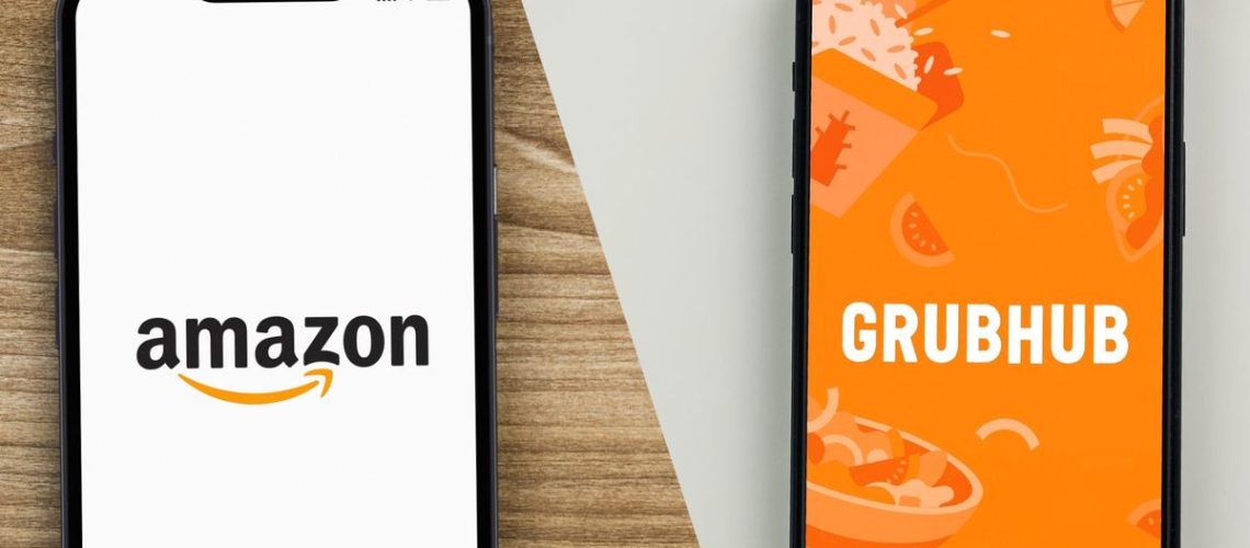 Amazon Prime logo on phone next to Grubhub logo on phone