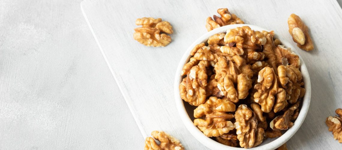 Ripe and fresh walnut kernels in bowl