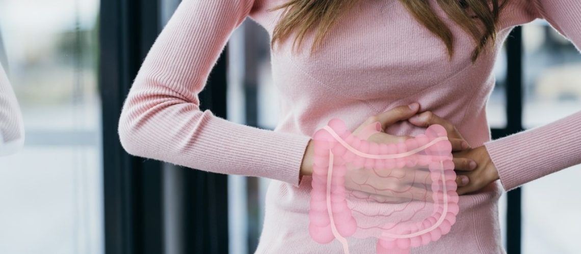 woman hands touching on stomach with intestine virtual icon