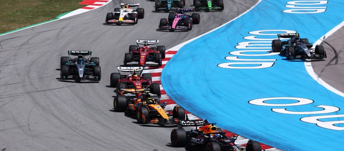 Max Verstappen of Red Bull Racing leads a tightly packed field of drivers during the F1 Grand Prix of Spain at Circuit de Barcelona-Catalunya.