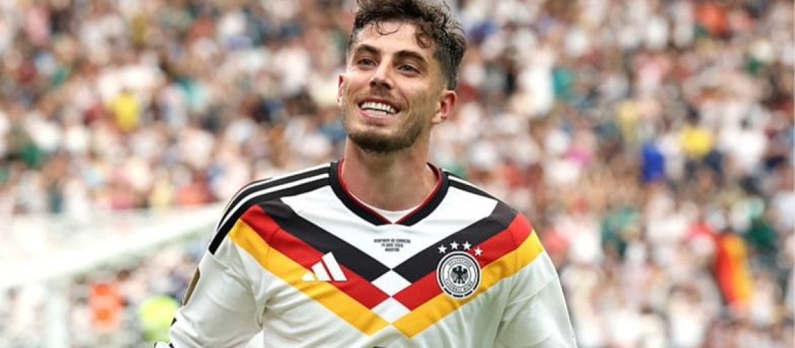 Kai Havertz of Germany celebrates scoring a goal at the World Cup 2026 by stretching his arms out.