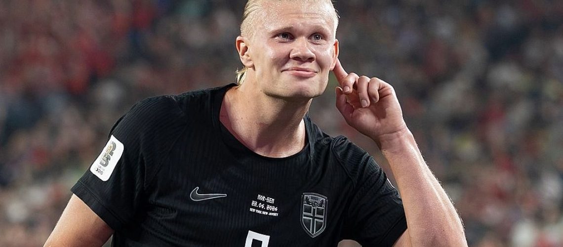 Erling Haaland, wearing Norway's black away kit, puts his finger to his ear after scoring for his country at the World Cup 2026.