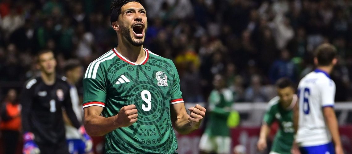 Raul Jimenez of Mexico clenches his fists while celebrating scoring his team's goal during a friendly match with Serbia at Nemesio Diez Stadium