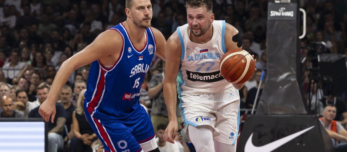 Luka Doncic (R) of Slovenia in action against Nikola Jokic of Serbia during the International Basketball Friendly match between Serbia and Slovenia at Belgrade Arena on August 21, 2025 in Belgrade, Serbia.