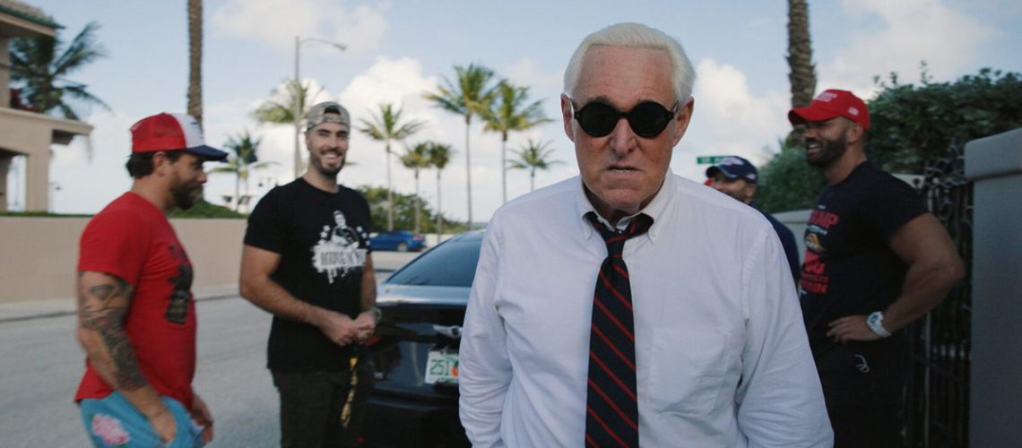 Veteran right-wing political operator Roger Stone [centre] is the focus of