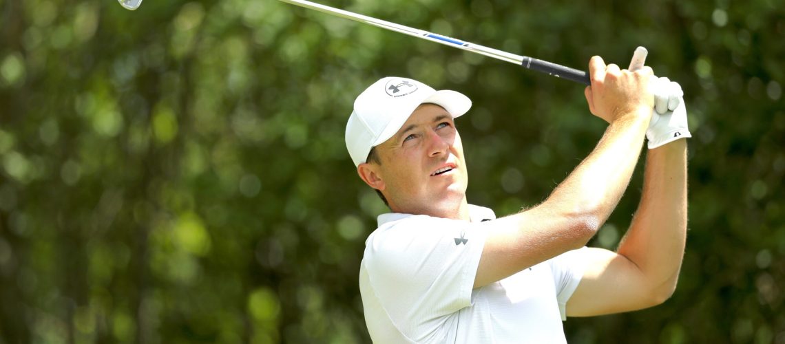 Jordan Spieth, wearing white cap, takes a swing ahead of the PGA Championship 2025
