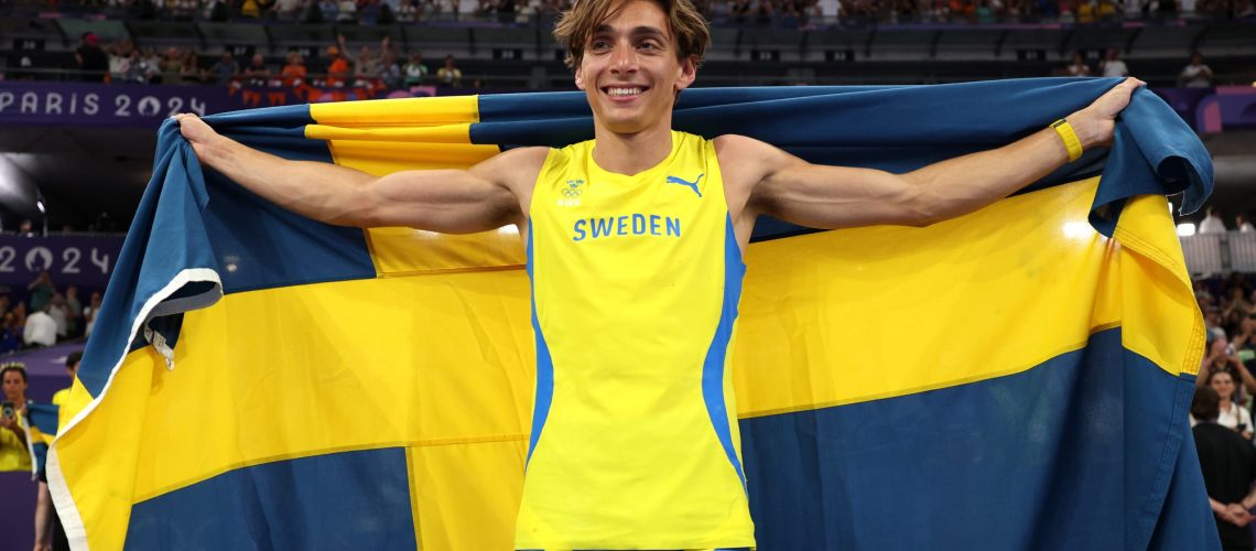 Gold medalist Armand Duplantis of Sweden celebrates after setting a new world record during the Men's Pole Vault Final on day ten of the Olympic Games Paris 2024 at Stade de France on August 05, 2024 in Paris, France.