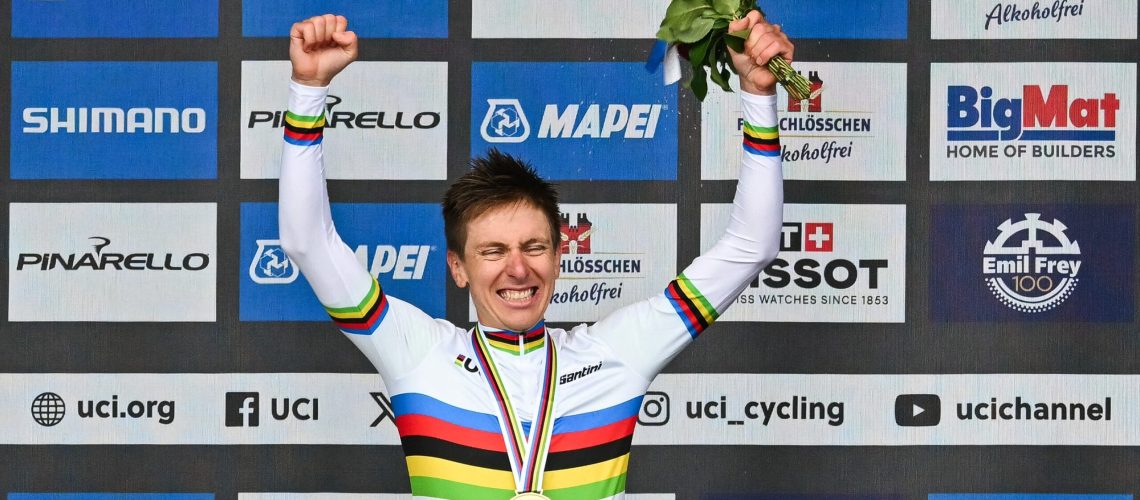 Winner Slovenia's Tadej Pogacar celebrates during the podium ceremony of the men's Elite Road Race cycling event as part of the UCI 2024 Road World Championships, in Zurich, on September 29, 2024.