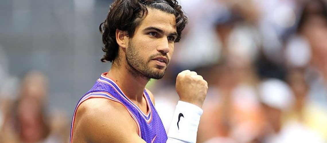 Carlos Alcaraz of Spain reacts with partner Serena Williams of the United States in their mixed doubles match against Erin Routliffe and Lloyd Glasspool.